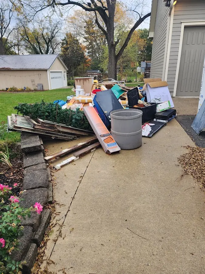 Dumpster being loaded with debris for 3 Yard Dumpster Rental in Ridgeland